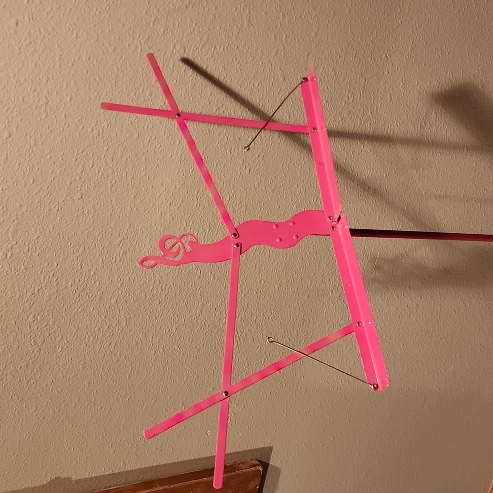 Pink metal music stand w/ Treble clef design